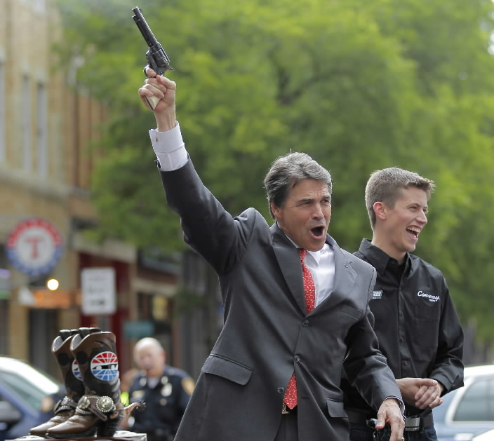 Rick-Perry-Shooting-A-Gun-Into-The-Air.png