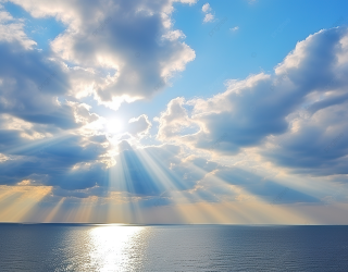 pngtree-a-sun-beam-comes-out-of-clouds-over-the-ocean-image_13158292.png