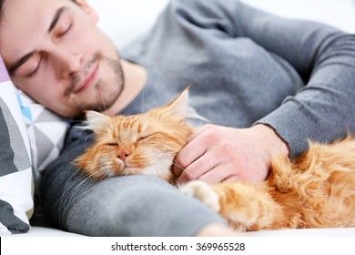 sleeping-young-man-fluffy-red-260nw-369965528.jpg