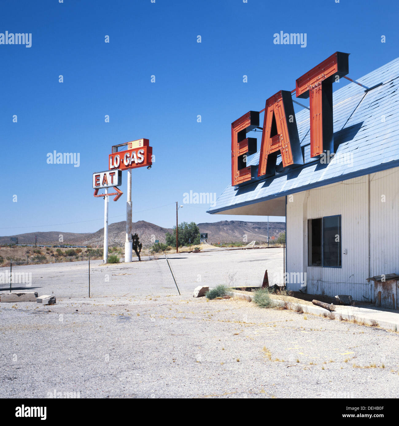 eat-and-gas-signs-outside-an-abandoned-gas-station-and-diner-off-interstate-DEHB0F.jpg