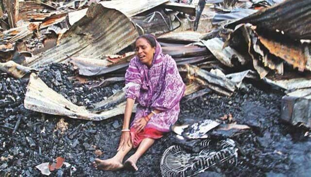 A-minority-Hindu-women-crying-after-her-house-and-local-temple-were-destroyed-by-Extremists.jpg
