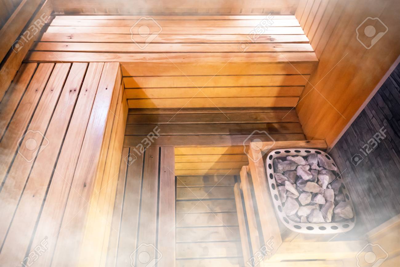 95393965-beautiful-nature-interior-home-finnish-sauna-room-background-inside-the-sauna-hot-stones-in-the-bath.jpg