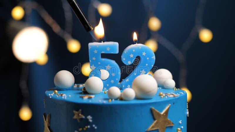 birthday-cake-number-stars-sky-moon-concept-blue-candle-fire-lighter-copyspace-right-side-screen-close-up-view-178016936.jpg