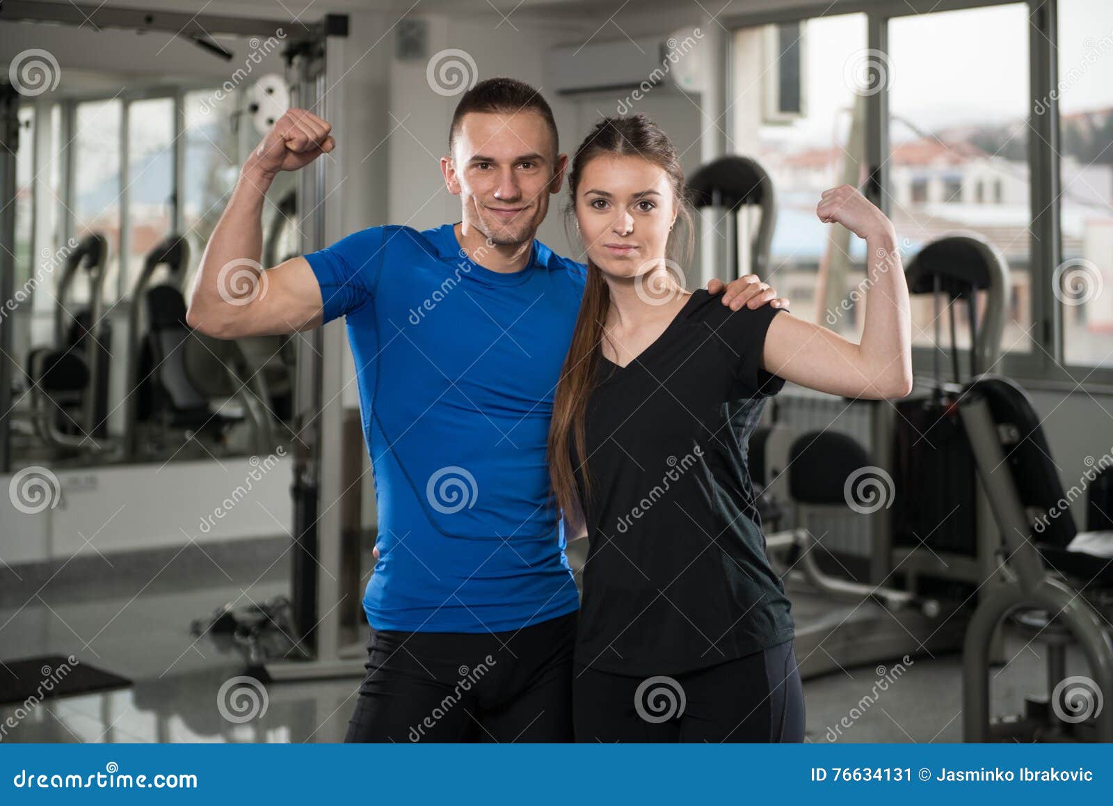 fit-couple-gym-looking-very-attractive-portrait-together-standing-positive-76634131.jpg