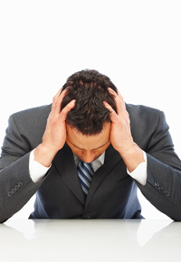 frustrated-businessman-with-head-in-hands.jpg